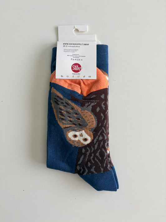 Unisex by Sock Supply. A stylised bird perched beside a tree trunk.